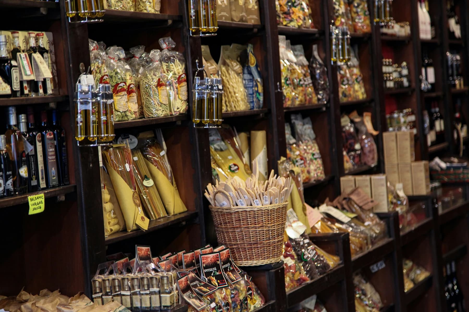 Shelves of dried pasta, olive oil, and artisan products in a Rome deli