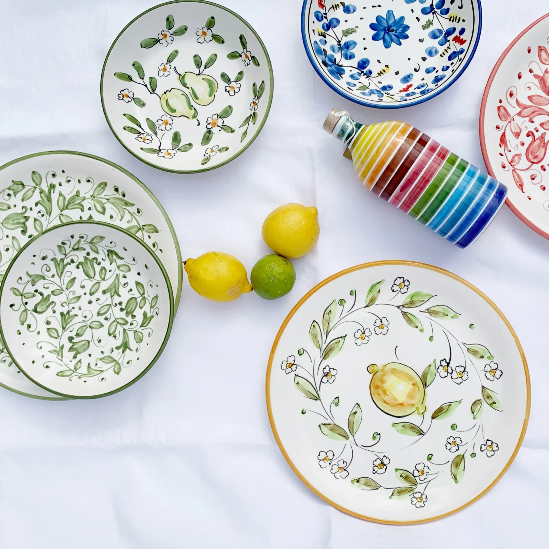 Hand-painted Italian majolica plates and bowls with botanical motifs