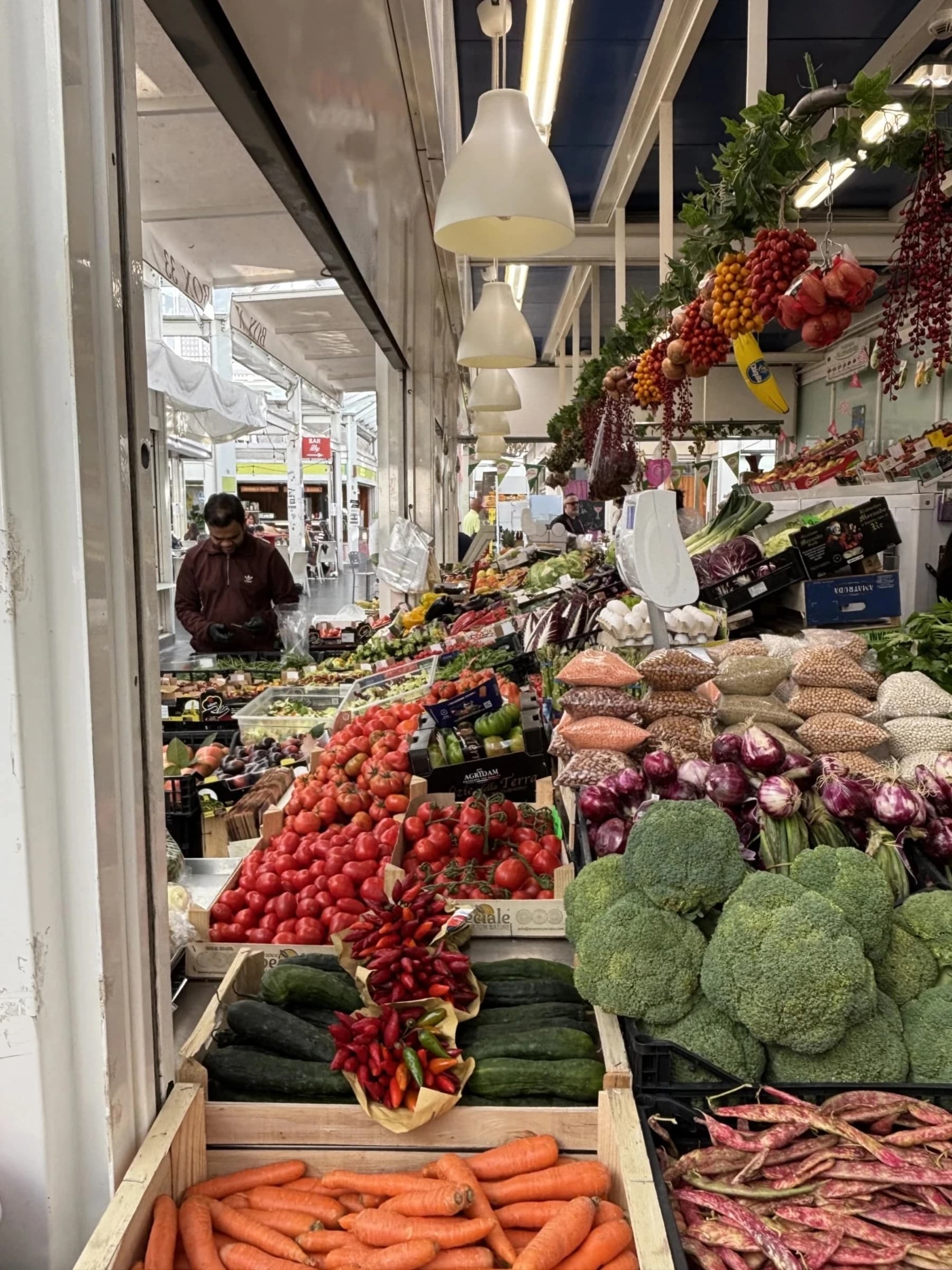 Vendor at a covered market in Rome