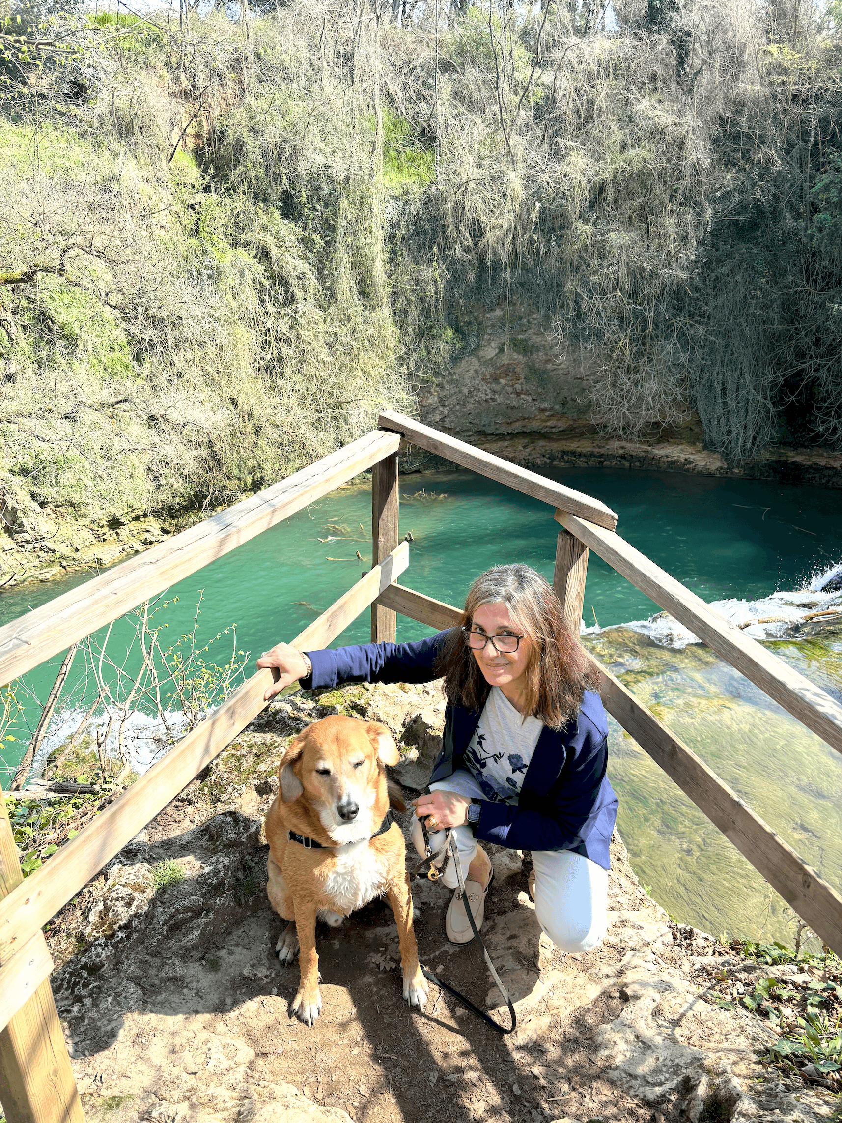Jojo and her dog Shek at a rocky overlook