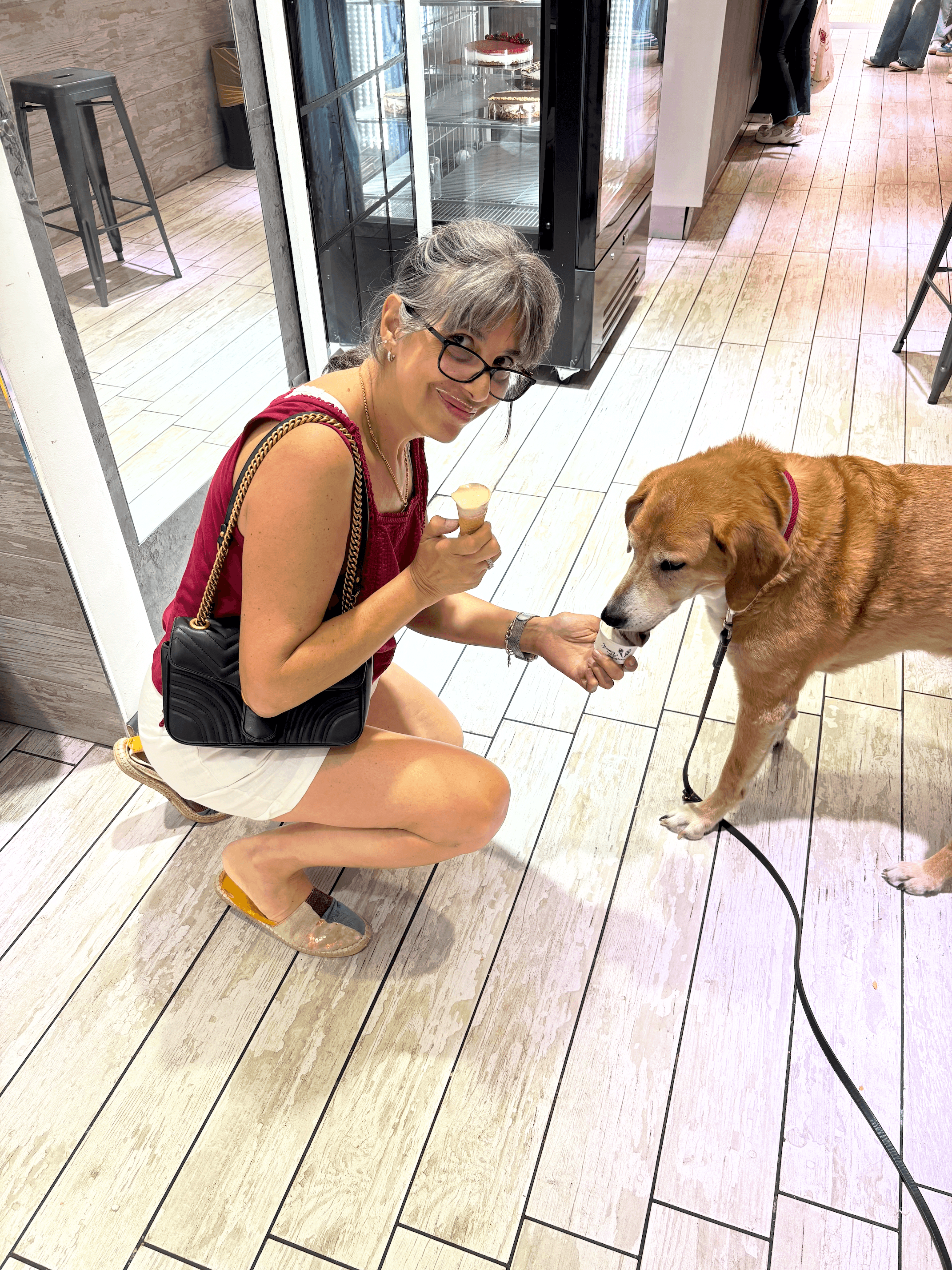 Jojo and her dog Shek at a gelateria in Testaccio